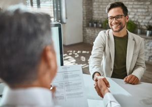 happy-male-candidate-greeting-member-human-resource-team-job-interview-office_637285-6567